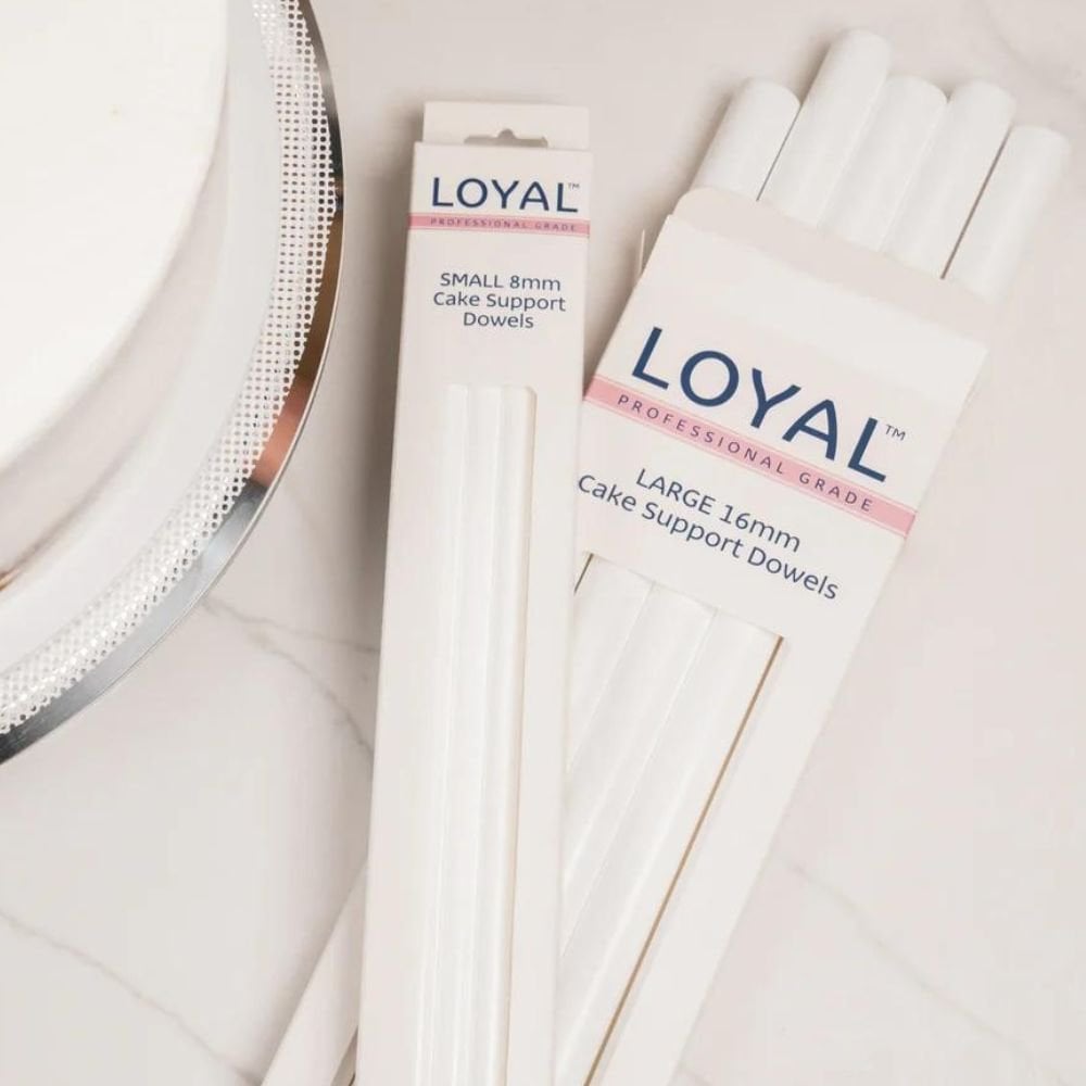 Two packages of Loyal cake support dowels on a light background